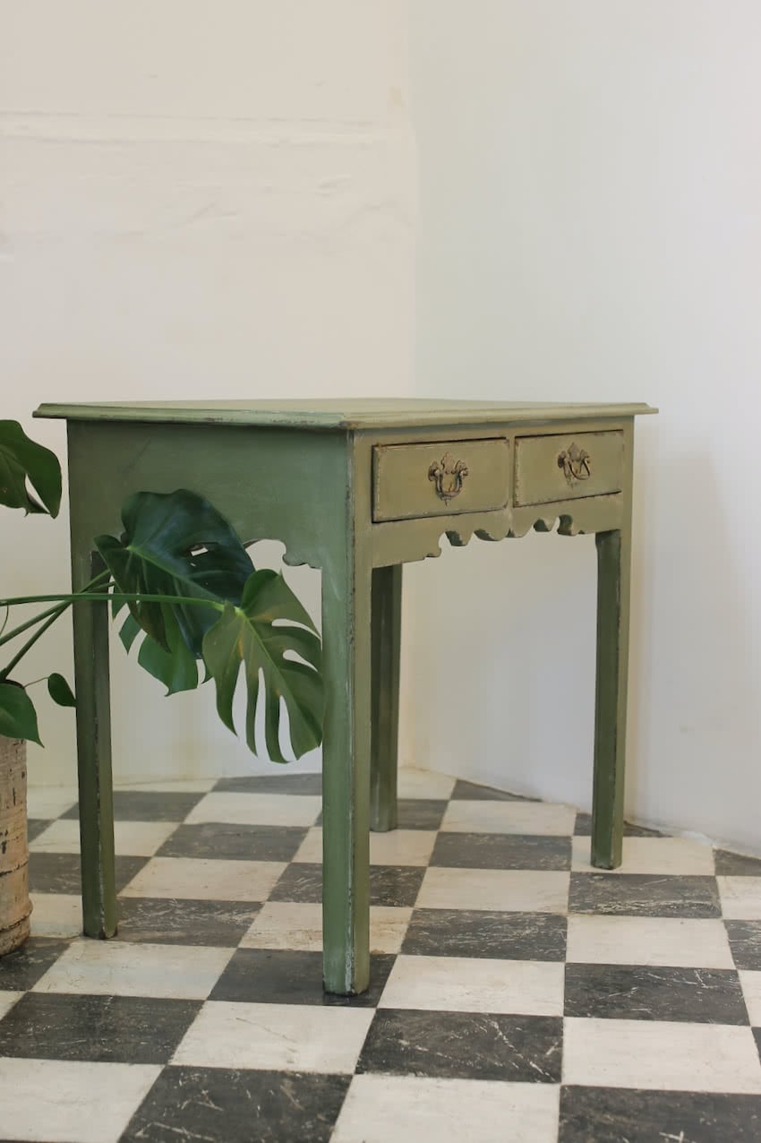 georgian painted pea green two drawer side table with pretty shaping on both front and sides, lovely brass handles and very old drawer lining paper inside.