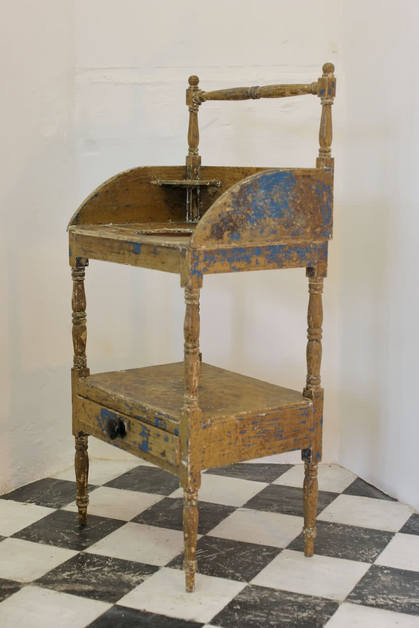 very pretty georgian pine washstand with original blue paint, drawer with large black wooden knob and towel rail.