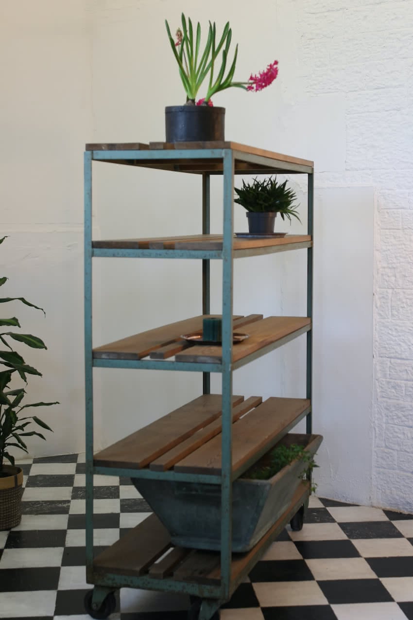 gorgeous old factory pine painted blue green metal rack with old solid pine shelves on the original casters.