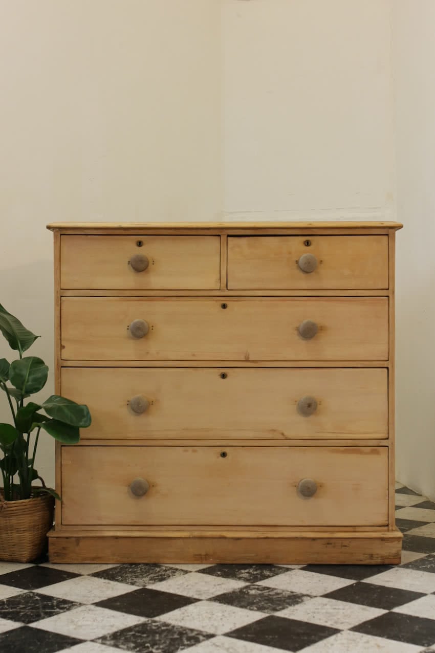 restored large blonde coloured victorian pine chest with five graduating drawers & large wooden knobs, the chest sits on a lovely shaped plinth, repair on the top.