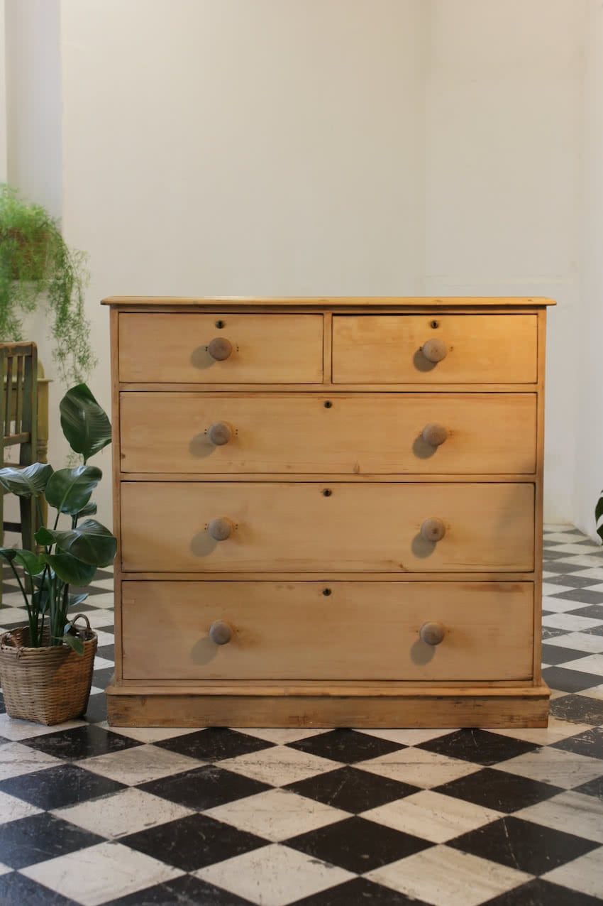 restored large blonde coloured victorian pine chest with five graduating drawers & large wooden knobs, the chest sits on a lovely shaped plinth, repair on the top.