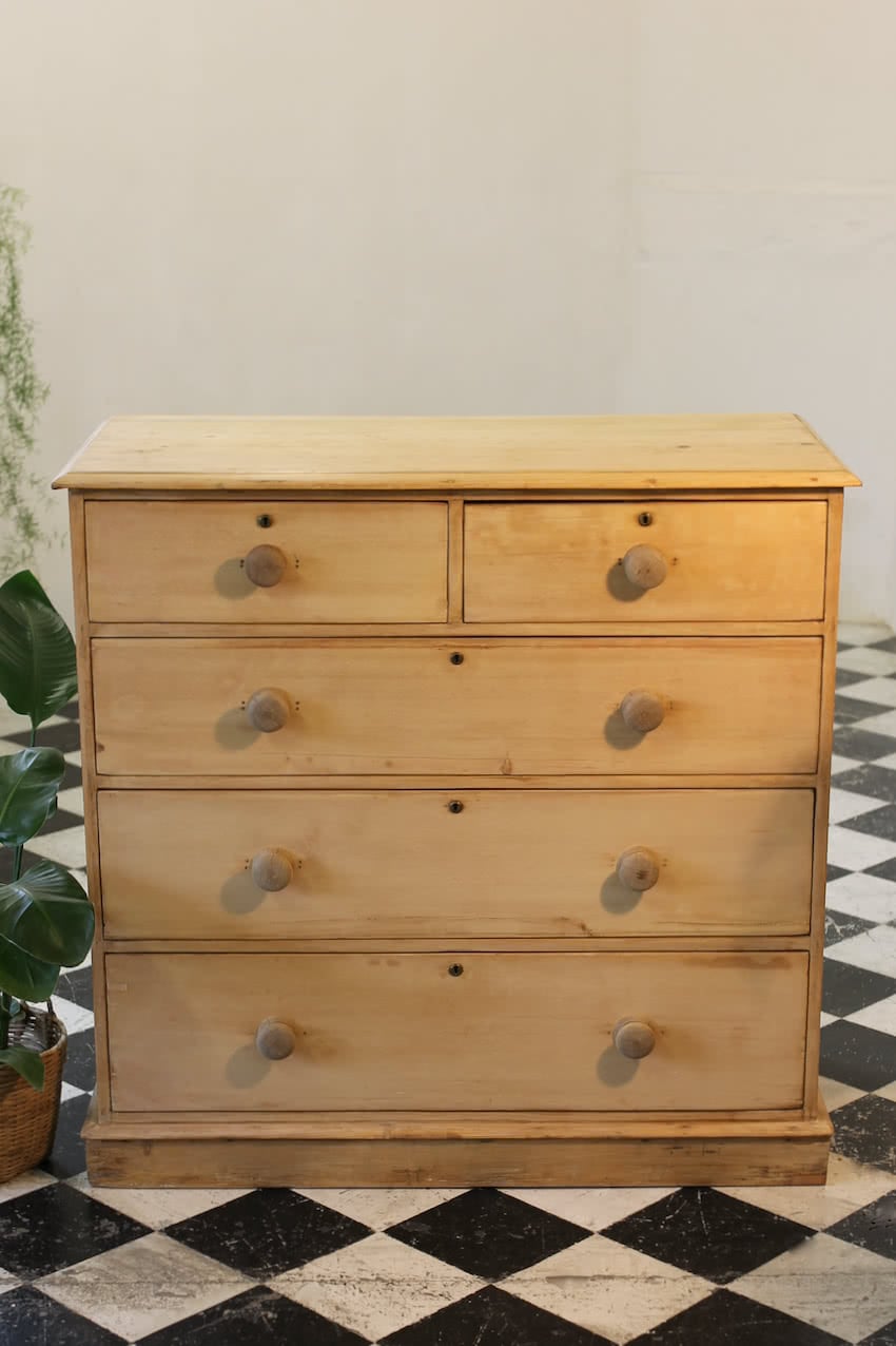 restored large blonde coloured victorian pine chest with five graduating drawers & large wooden knobs, the chest sits on a lovely shaped plinth, repair on the top.
