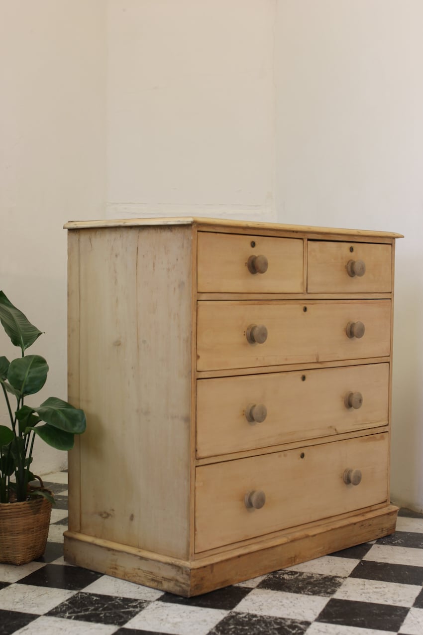 restored large blonde coloured victorian pine chest with five graduating drawers & large wooden knobs, the chest sits on a lovely shaped plinth, repair on the top.