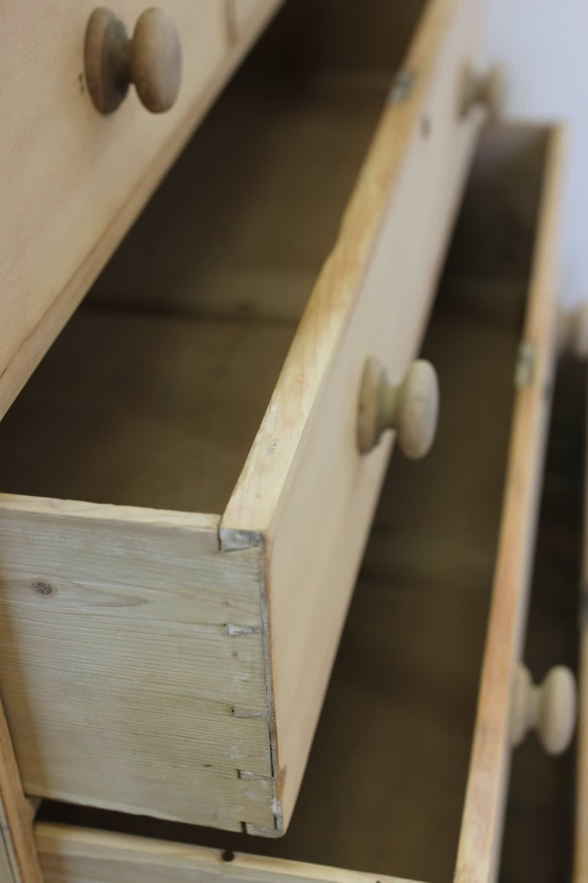 restored large blonde coloured victorian pine chest with five graduating drawers & large wooden knobs, the chest sits on a lovely shaped plinth, repair on the top.