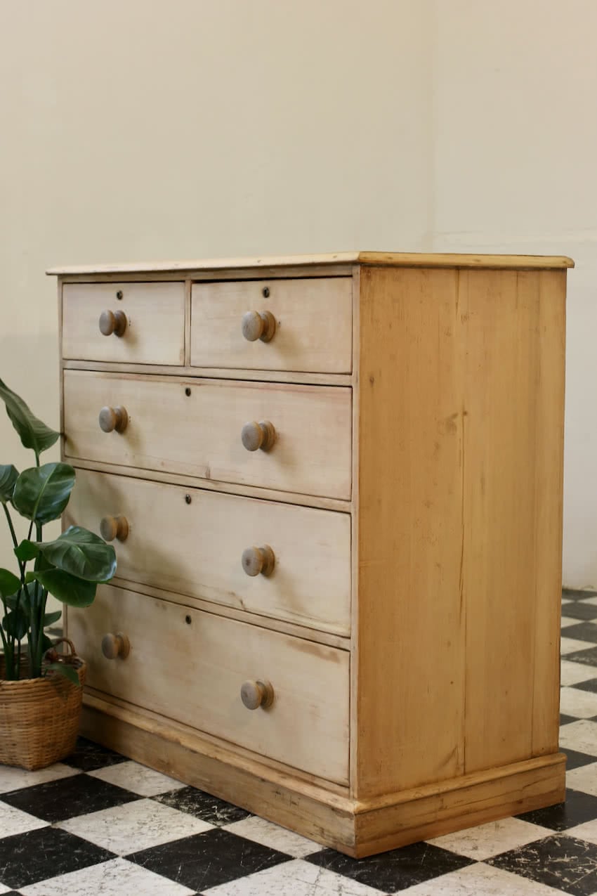 restored large blonde coloured victorian pine chest with five graduating drawers & large wooden knobs, the chest sits on a lovely shaped plinth, repair on the top.
