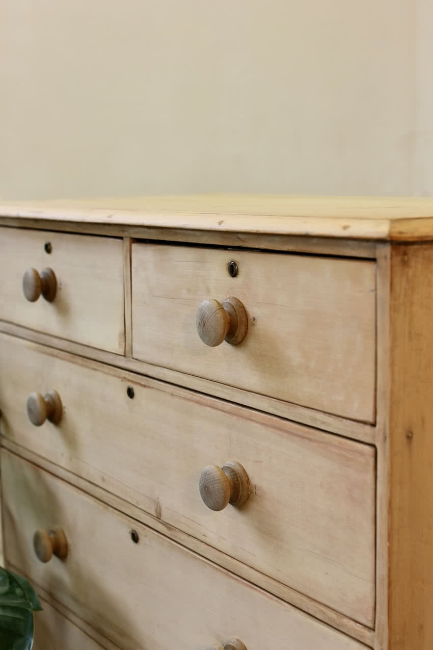 restored large blonde coloured victorian pine chest with five graduating drawers & large wooden knobs, the chest sits on a lovely shaped plinth, repair on the top.