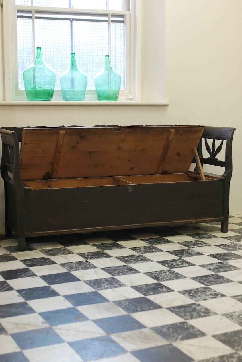 gorgeous european pine bench in original black brown paint & patina, with scrolled arms & pretty detailing, plenty of storage inside.