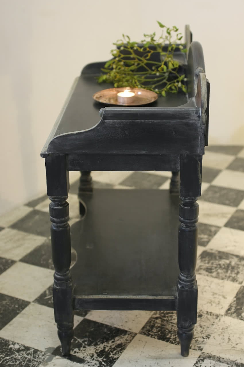 pretty painted black victorian pine washstand with scrolled arms, shaped back, pot board & typical shaping on turned legs.
