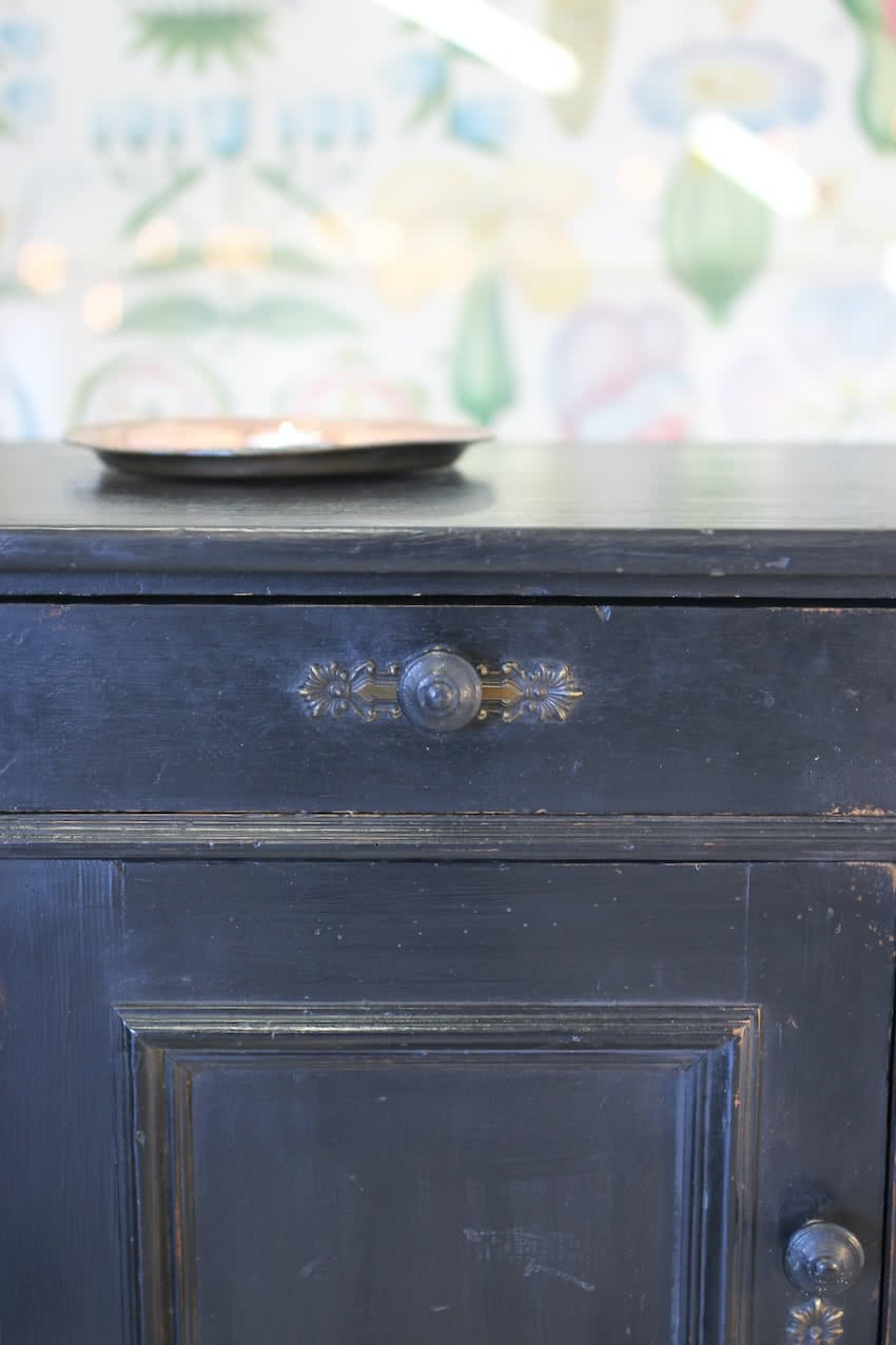 pretty little european pine one drawer cupboard with part painted blue interior, original wooden knobs, large brass escutcheons and small turned feet.