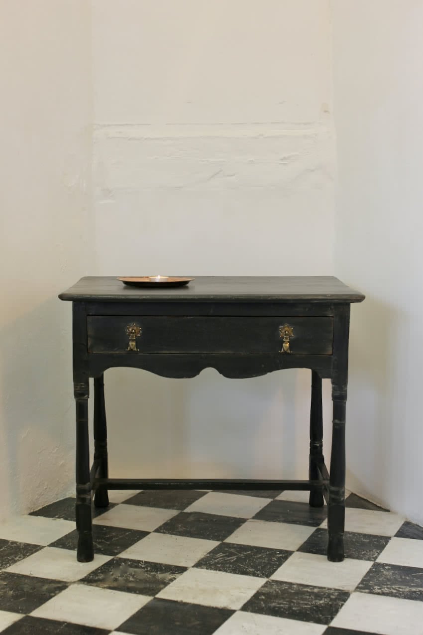 very pretty black restored & refinished one drawer table with painted green interior & gorgeous brass handles and a waxed finish.