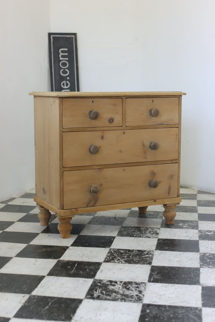 english four drawer antique pine chest completey restored with new knobs and feet of the period.