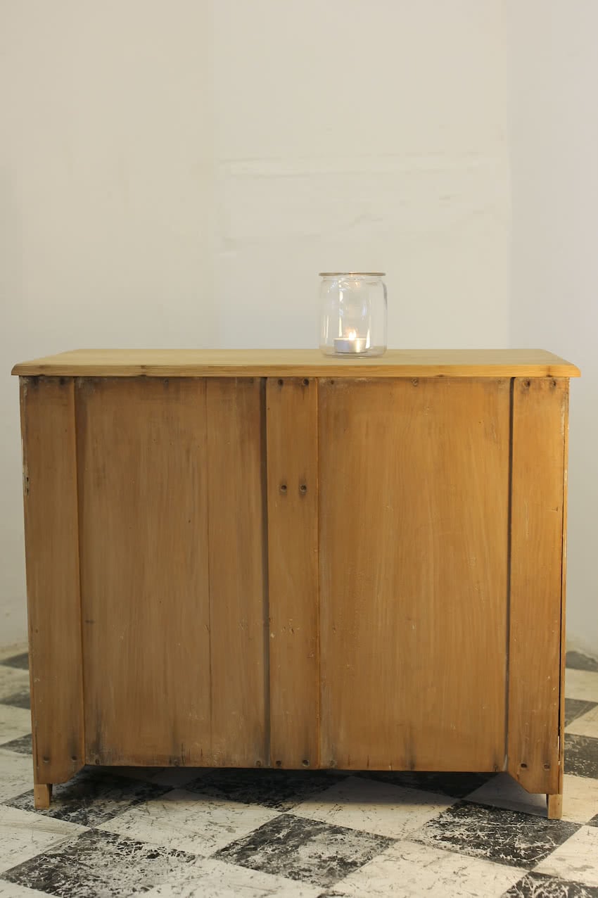 cute victorian stripped pine chest with contrasting wooden knobs and in natural finish with neat shaped plinth & feet.