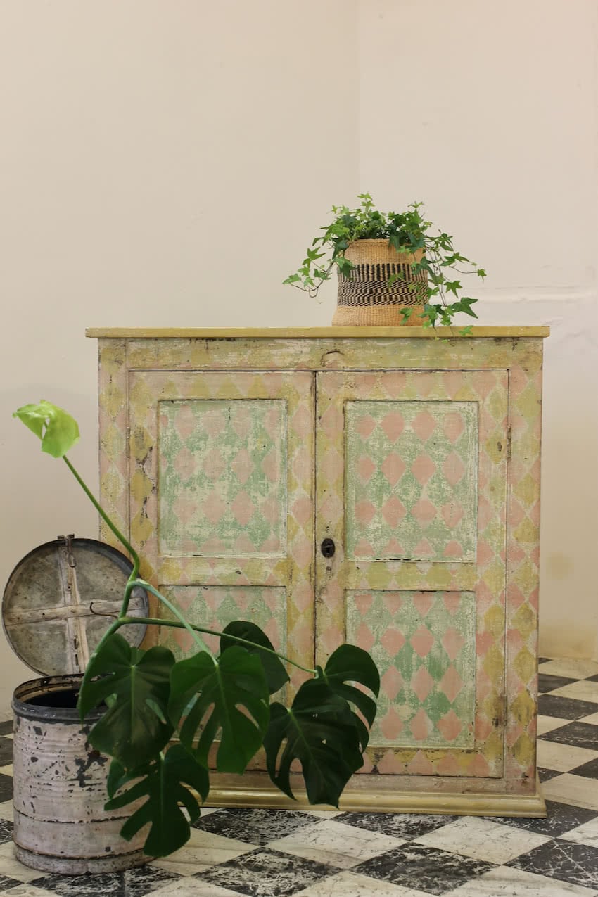 beautiful english hand scraped original painted pine cupboard with a geometric pattern, the interior & shelves have been painted in an off white.