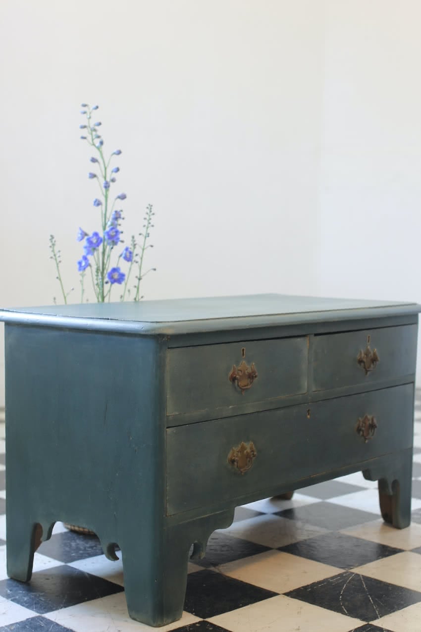 beautifully shaped low rstored and refinished english painted pine chest of drawers with brass swan neck handles & pretty shaped feet.