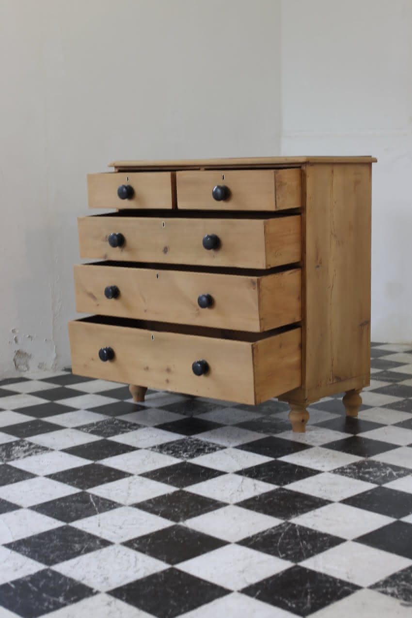 gorgeous looking stripped pine restored victorian chest with five graduating drawers & mostly original dark wooden knobs, & new feet.