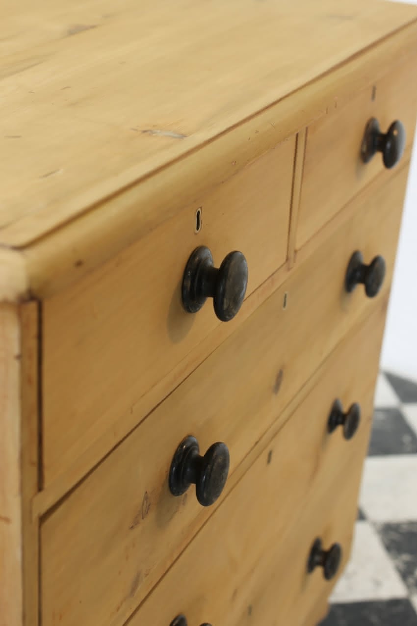 gorgeous looking stripped pine restored victorian chest with five graduating drawers & mostly original dark wooden knobs, & new feet.