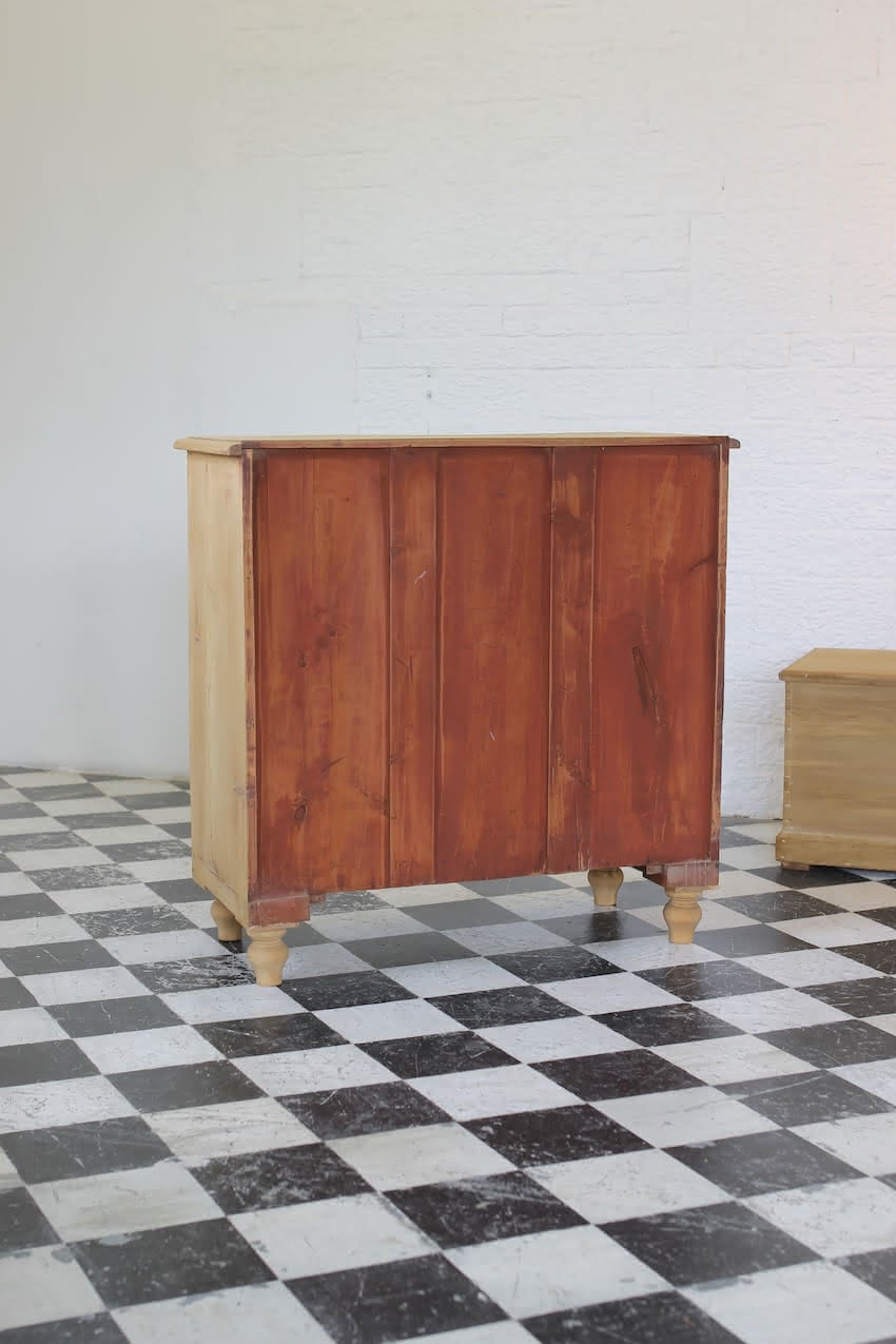 gorgeous looking stripped pine restored victorian chest with five graduating drawers & mostly original dark wooden knobs, & new feet.