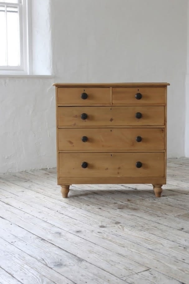 gorgeous looking stripped pine restored victorian chest with five graduating drawers & mostly original dark wooden knobs, & new feet.