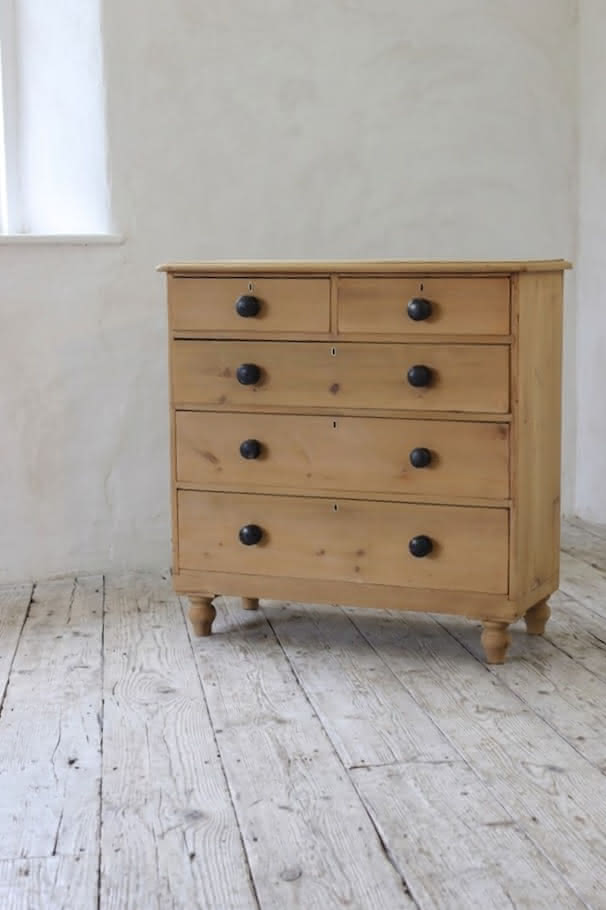 gorgeous looking stripped pine restored victorian chest with five graduating drawers & mostly original dark wooden knobs, & new feet.