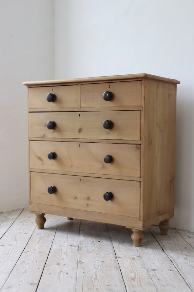 gorgeous looking stripped pine restored victorian chest with five graduating drawers & mostly original dark wooden knobs, & new feet.