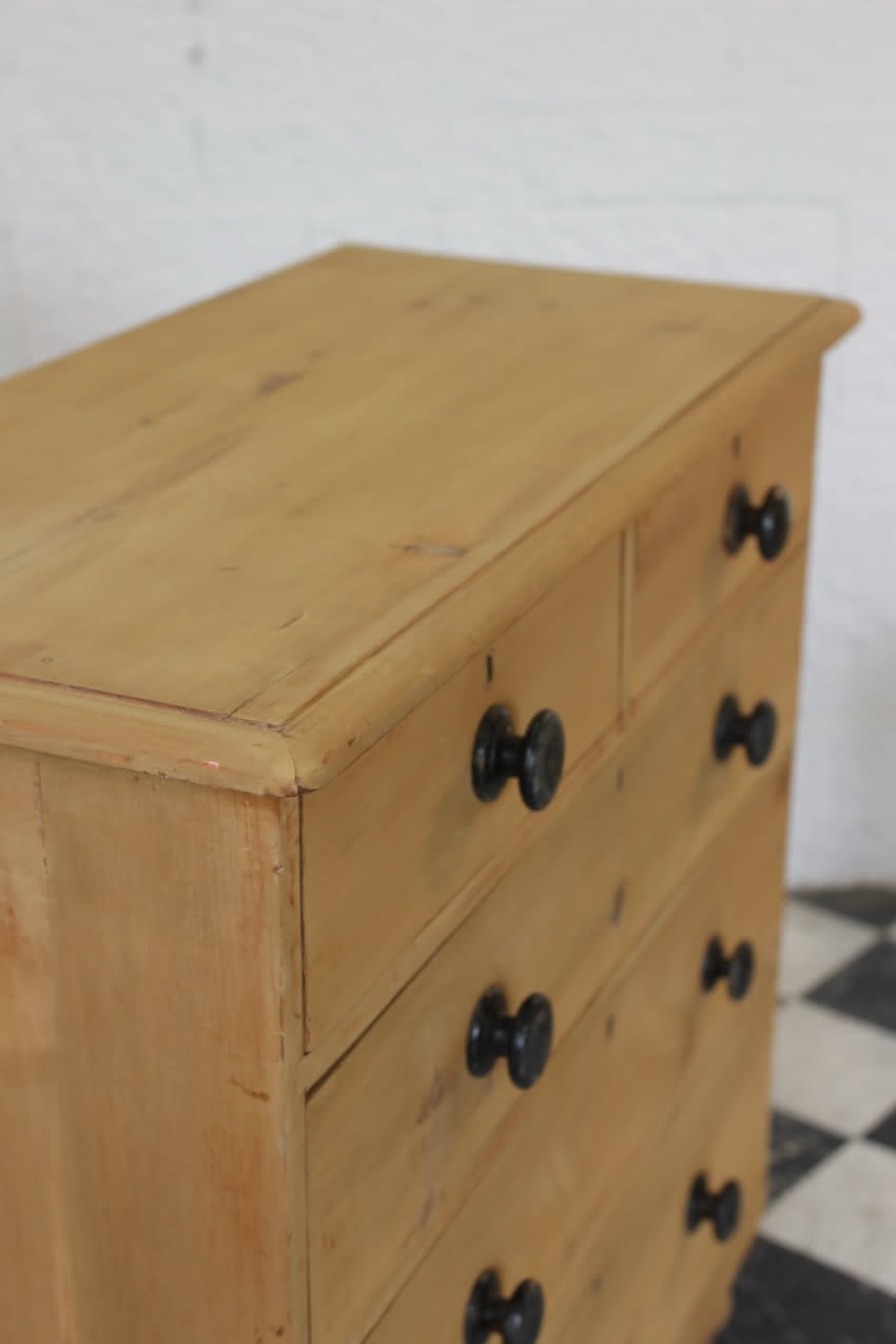 gorgeous looking stripped pine restored victorian chest with five graduating drawers & mostly original dark wooden knobs, & new feet.
