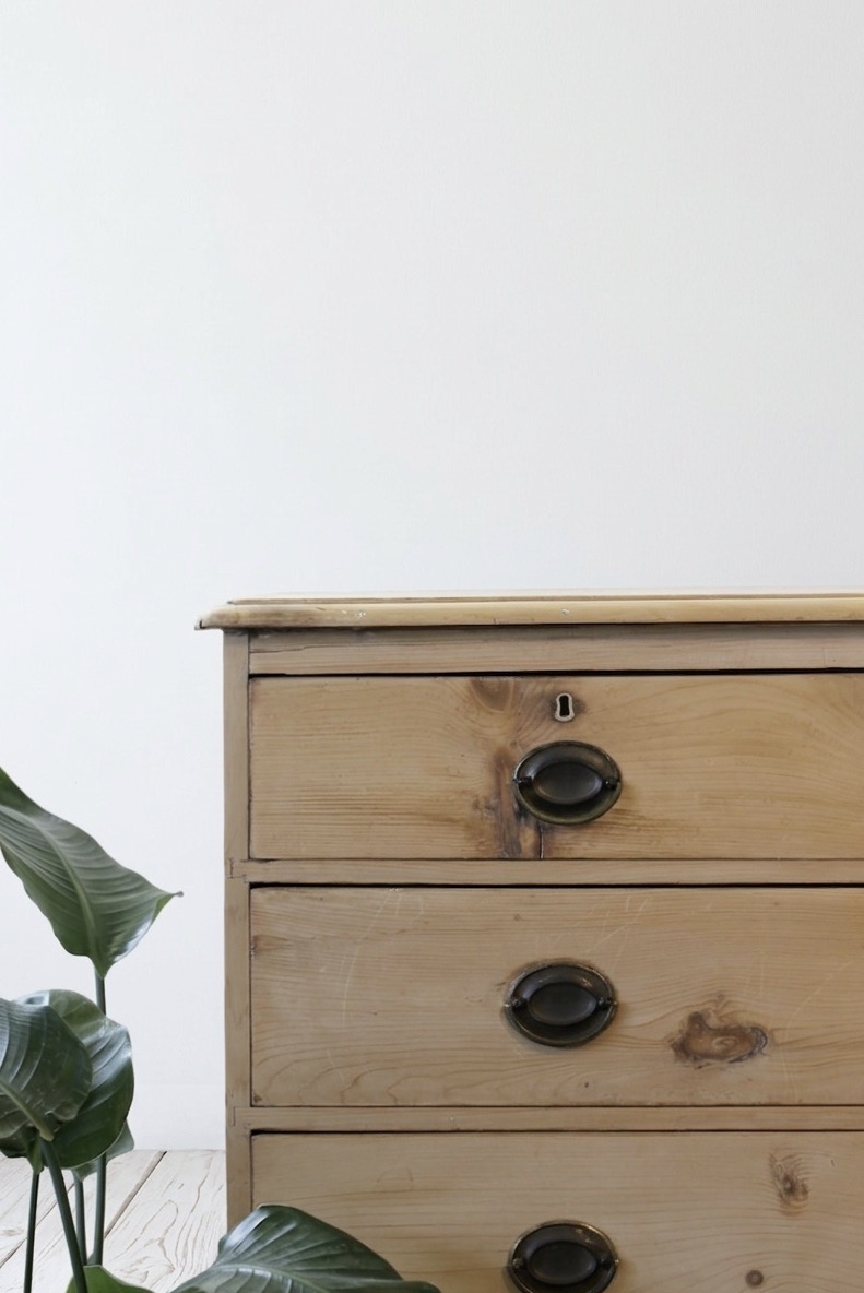 restored english antique pine chest of five graduating drawers with brass oval handles & pretty new tulip shaped feet.