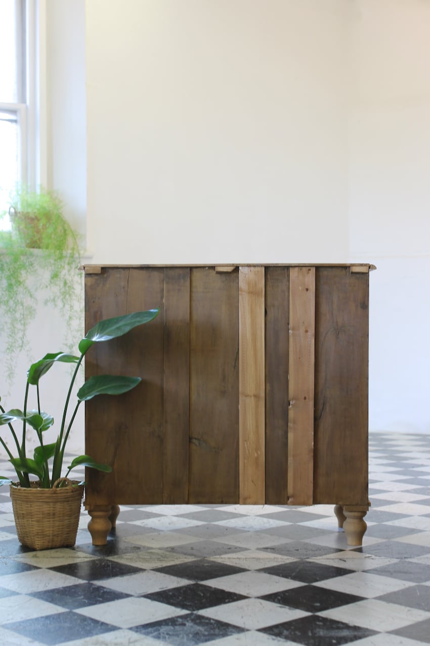 restored english antique pine chest of five graduating drawers with brass oval handles & pretty new tulip shaped feet.