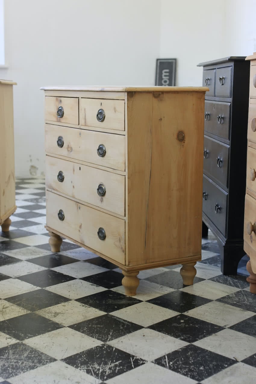 restored english antique pine chest of five graduating drawers with brass oval handles & pretty new tulip shaped feet.