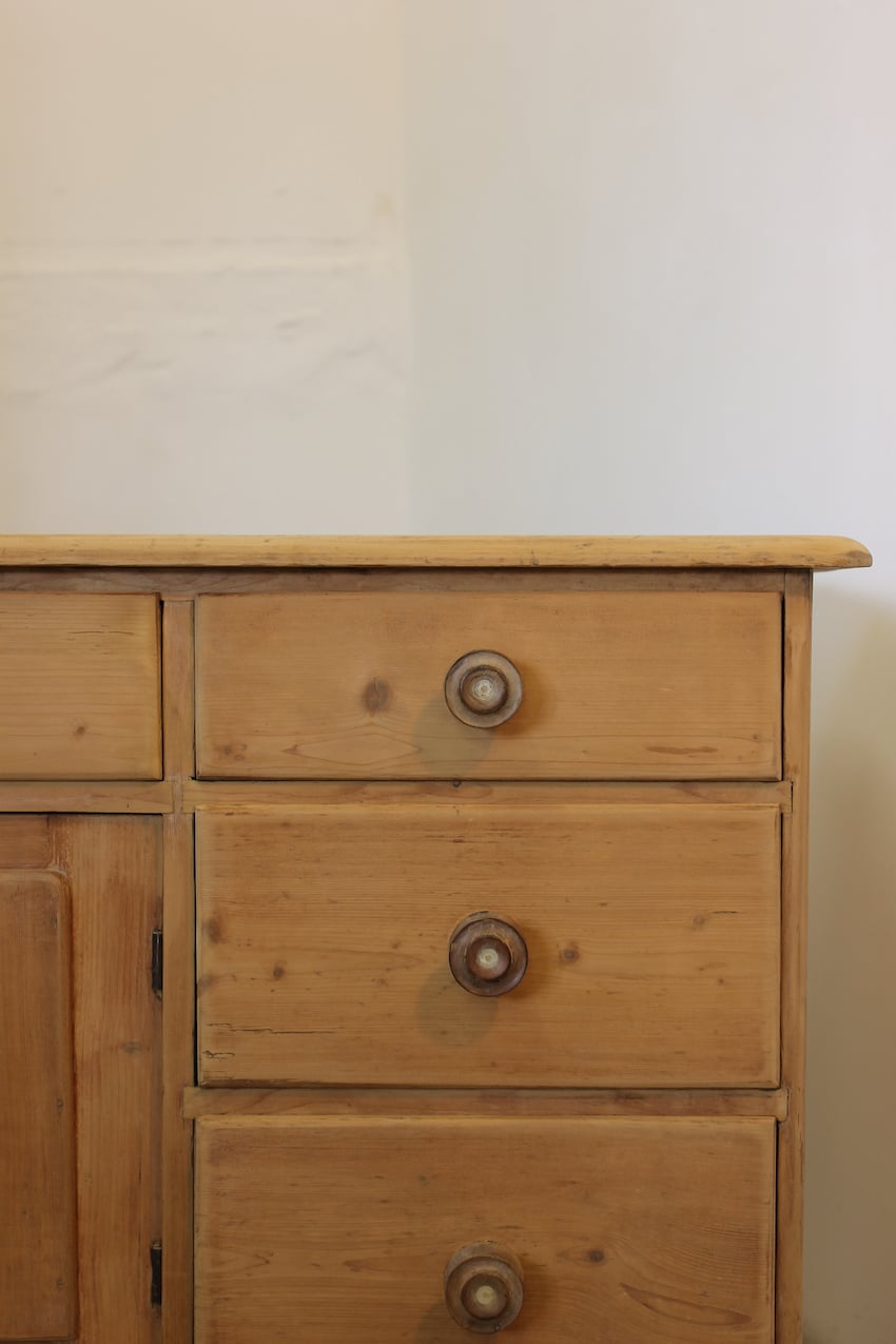 restored english cupboard with drawers, original knobs with mother of pearl, a cupboard with shelf & four new pine feet.