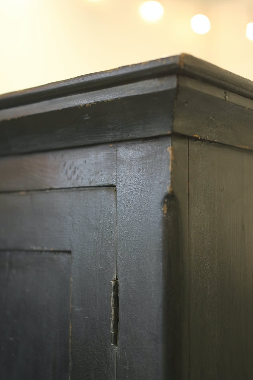 large english painted black pine cupboard with shelves and hanging rail, a painted blue interior& brass knob and working lock and key.