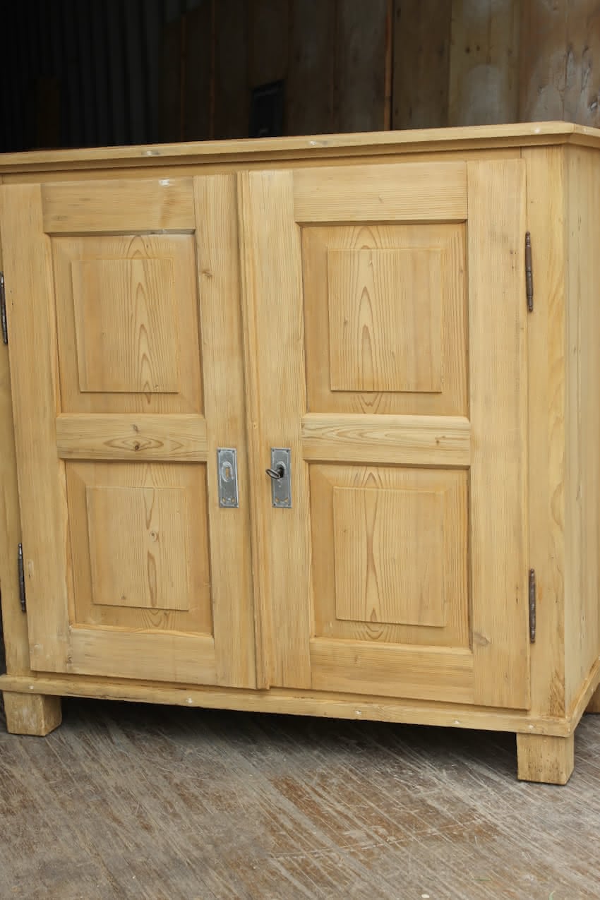 gorgeous very clean english pine cupboard two door base with one long original shelf inside and two brass round knobs.