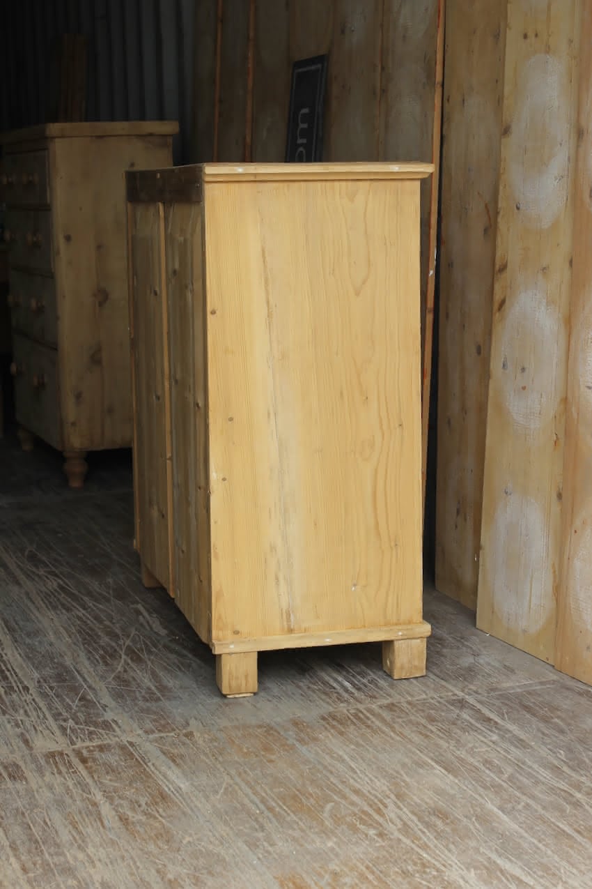 gorgeous very clean english pine cupboard two door base with one long original shelf inside and two brass round knobs.
