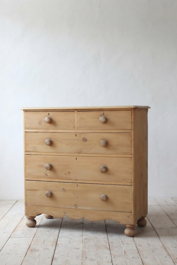 beautiful fine pine honey coloured english chest with five drawers and skirt with pretty detailing & original bun feet, very clean condition.