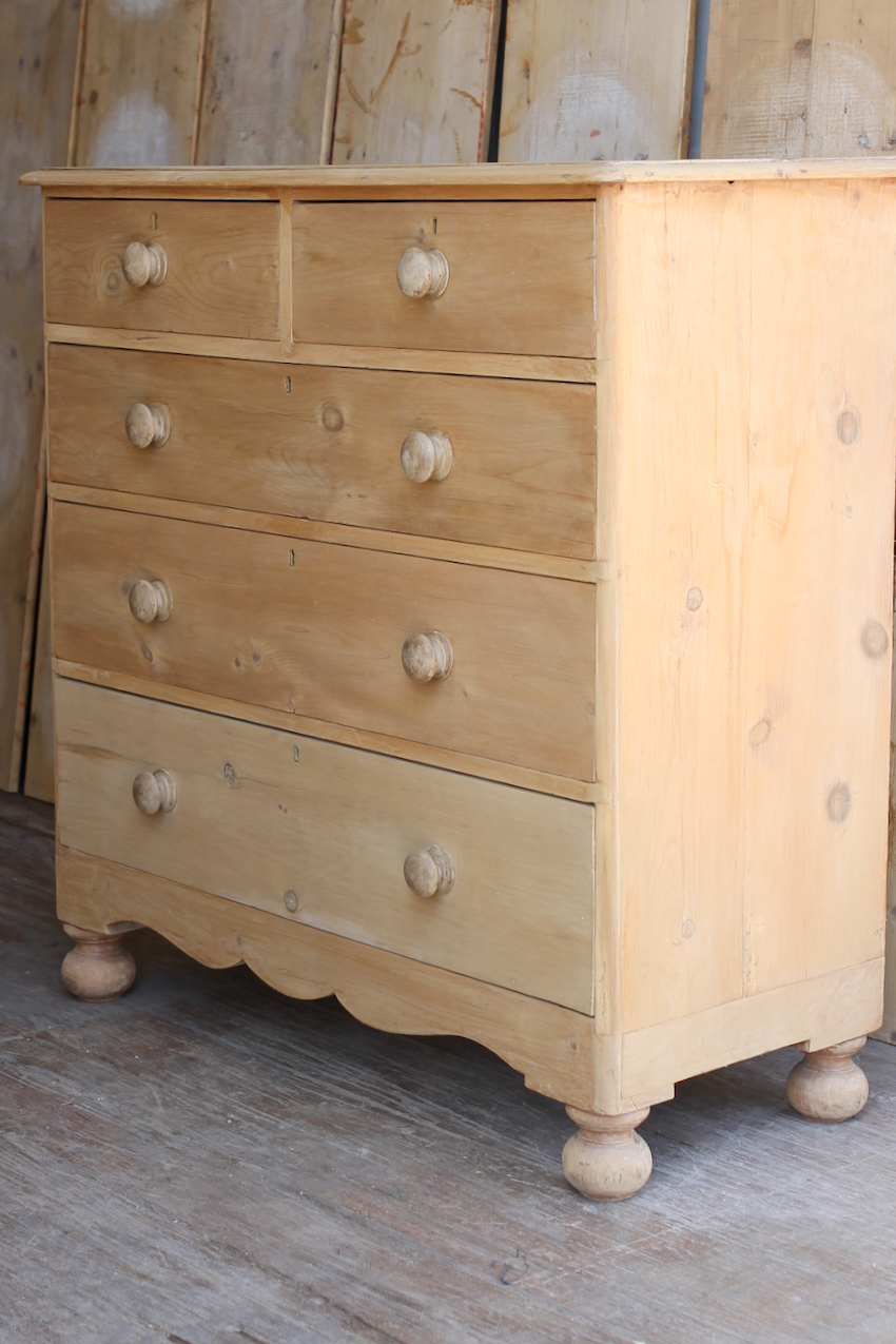 beautiful fine pine honey coloured english chest with five drawers and skirt with pretty detailing & original bun feet, very clean condition.