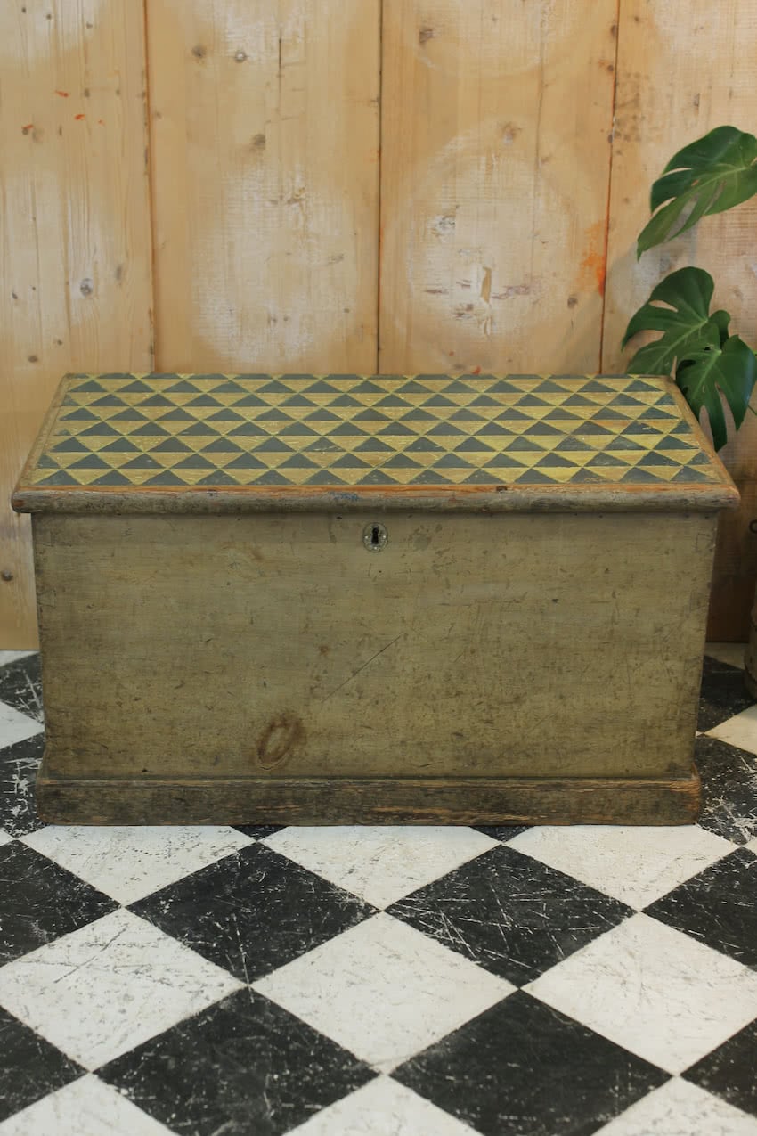 beautiful victorian pine linen chest with original paint & repainted geo pattern on top in lichen and navy & a secret candle box inside.