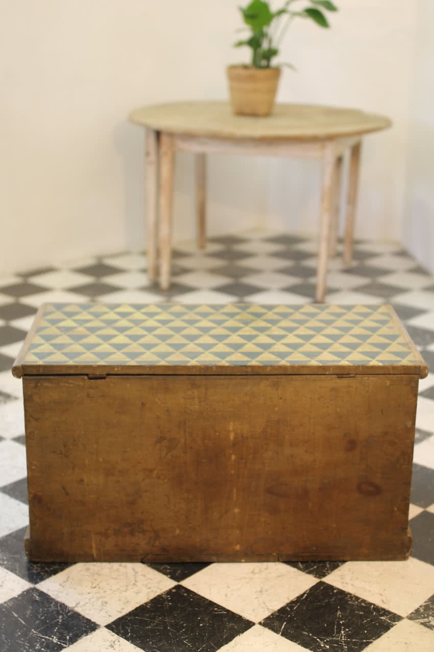 beautiful victorian pine linen chest with original paint & repainted geo pattern on top in lichen and navy & a secret candle box inside.