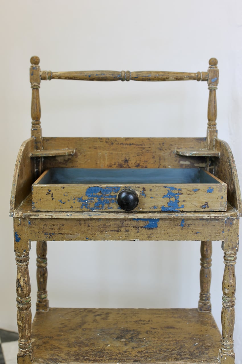 very pretty georgian pine washstand with original blue paint, drawer with large black wooden knob and towel rail.