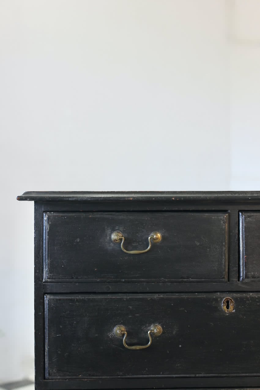 restored & refinished georgian tall pine black chest of five graduating drawers with brass swan neck handles & typical shaped feet.