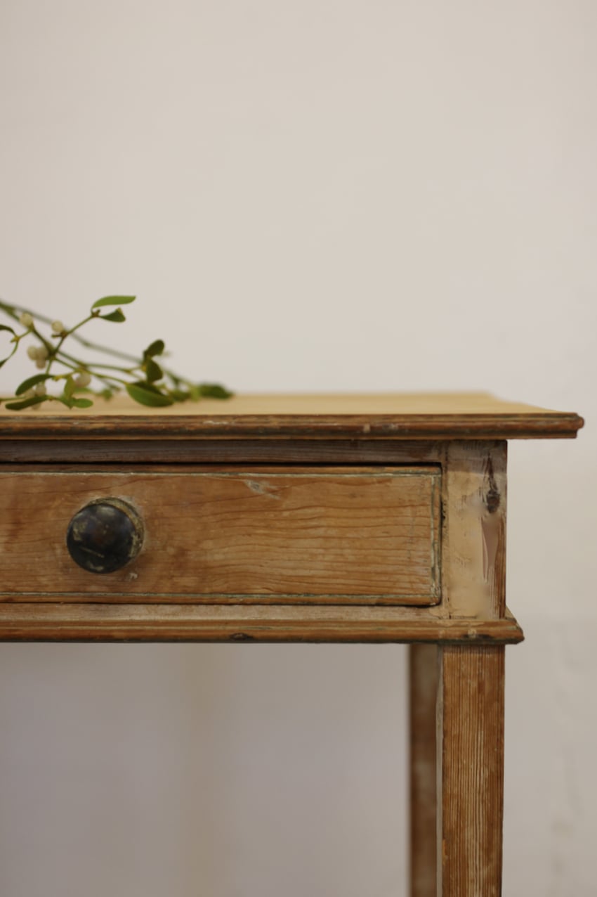beautiful sympathetically restored table with wide drawer, wooden knobs, one has a bit missing, slender tapering legs and original paint.