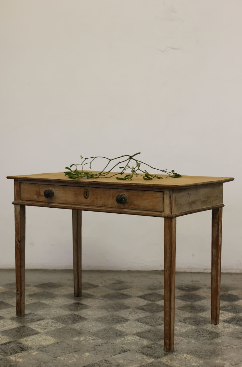 beautiful sympathetically restored table with wide drawer, wooden knobs, one has a bit missing, slender tapering legs and original paint.