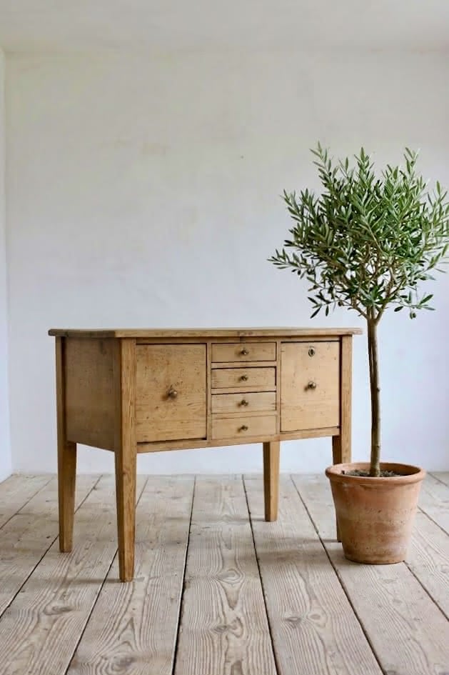 charming restored pine rustic looking console table with two deep drawers & three shallow plus a faux drawer.