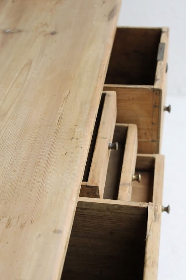 charming restored pine rustic looking console table with two deep drawers & three shallow plus a faux drawer.