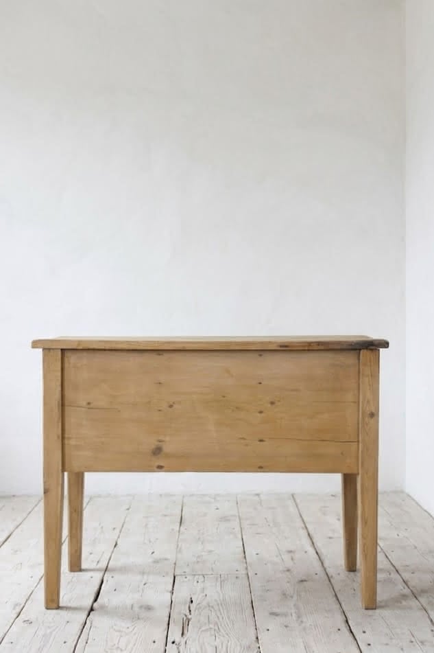 charming restored pine rustic looking console table with two deep drawers & three shallow plus a faux drawer.