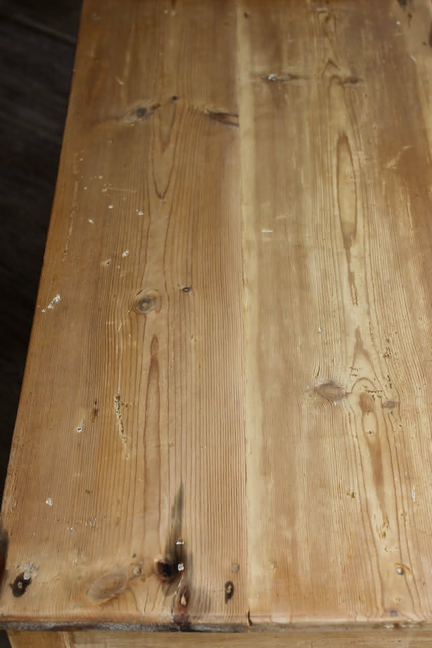 charming restored pine rustic looking console table with two deep drawers & three shallow plus a faux drawer.