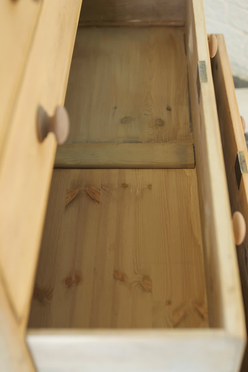 beautiful restored very large pine chest with six graduating drawers, contrasting wooden knobs and new tulip shaped turned feet.