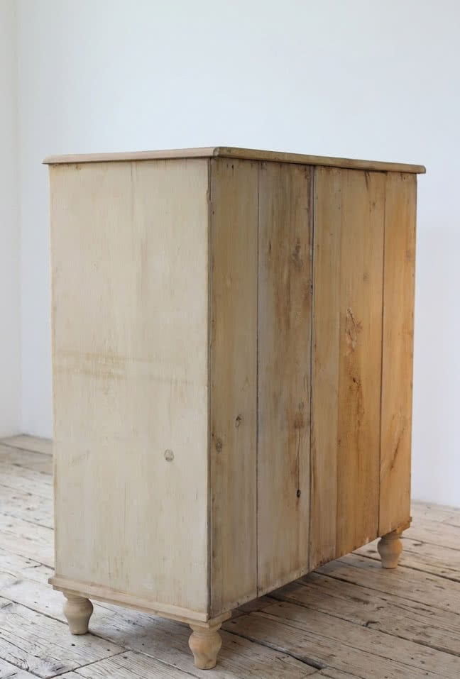 beautiful restored very large pine chest with six graduating drawers, contrasting wooden knobs and new tulip shaped turned feet.