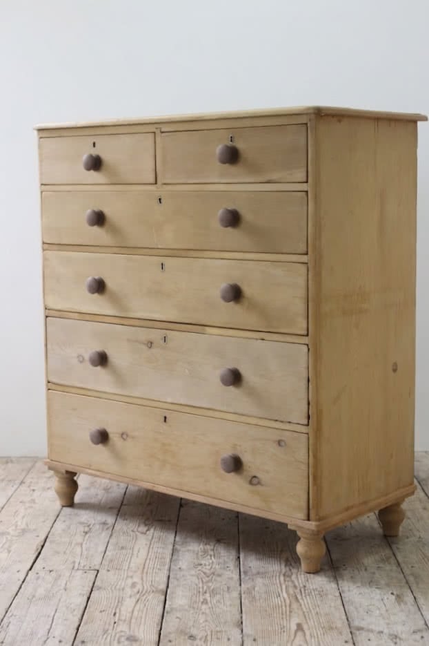 beautiful restored very large pine chest with six graduating drawers, contrasting wooden knobs and new tulip shaped turned feet.