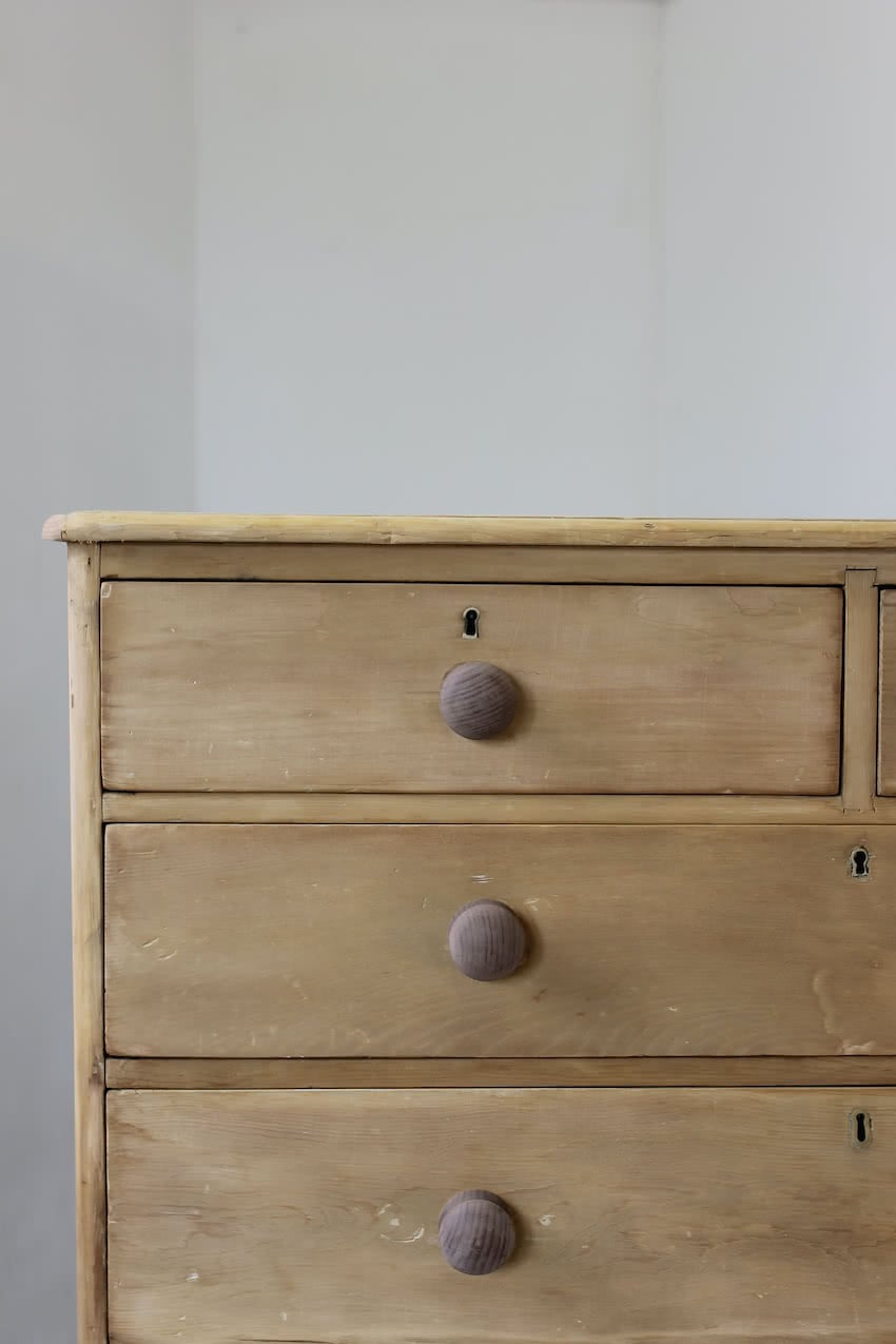 beautiful restored very large pine chest with six graduating drawers, contrasting wooden knobs and new tulip shaped turned feet.