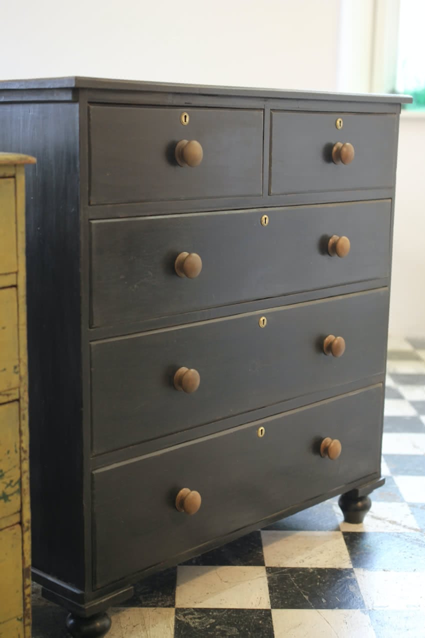 large victorian pine painted black chest with five graduating drawers, contrasting brown knobs & turned feet, very solid and heavy.