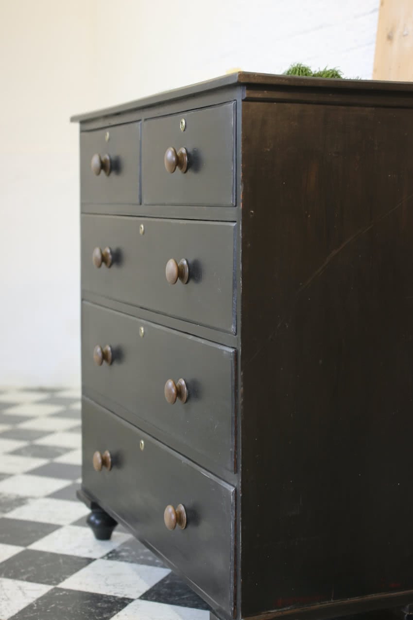 large victorian pine painted black chest with five graduating drawers, contrasting brown knobs & turned feet, very solid and heavy.